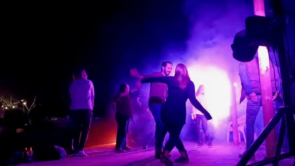 Dance floor in purple light and smoke